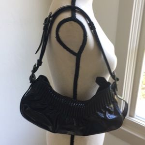 Women’s patten leather Burberry purse.